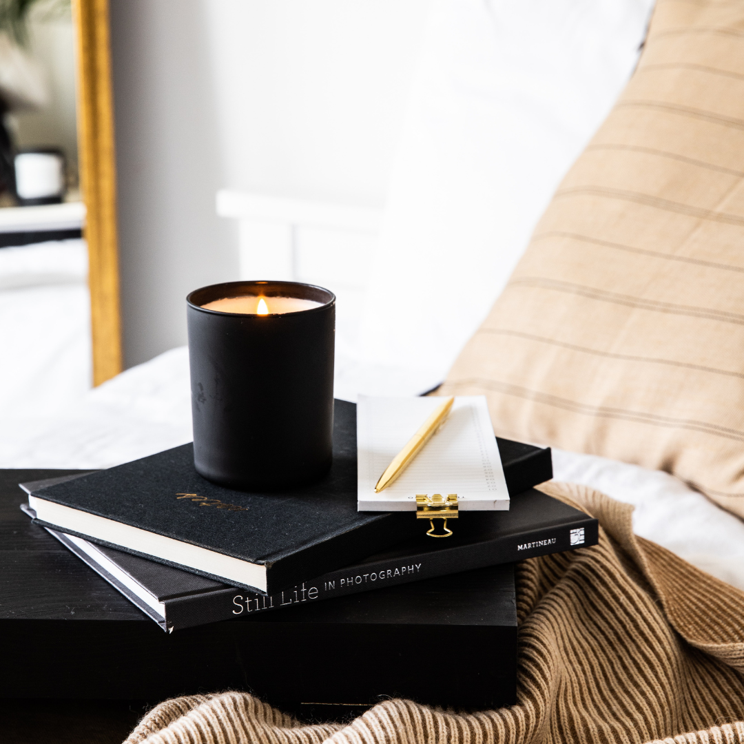 stunning black candle with black books photography 